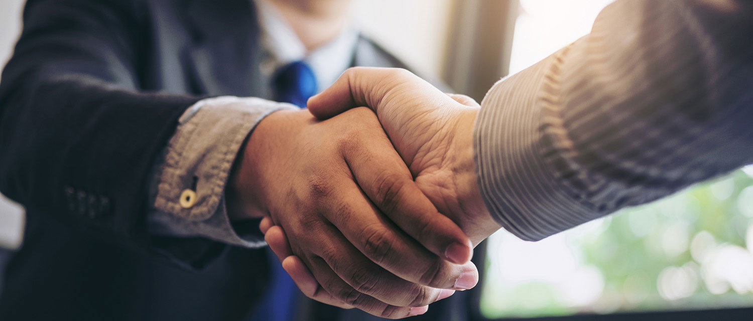 Business handshake partnership concept